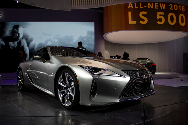 One of my favorites from the show, I thought this picture came out nice and I like the way the light reflects in the different curves of the car and how the screen in the background captured the guy and the car looking in the same direction.
